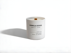 Vanilla scented candle labeled 'Vanilla Kisses' on a white background