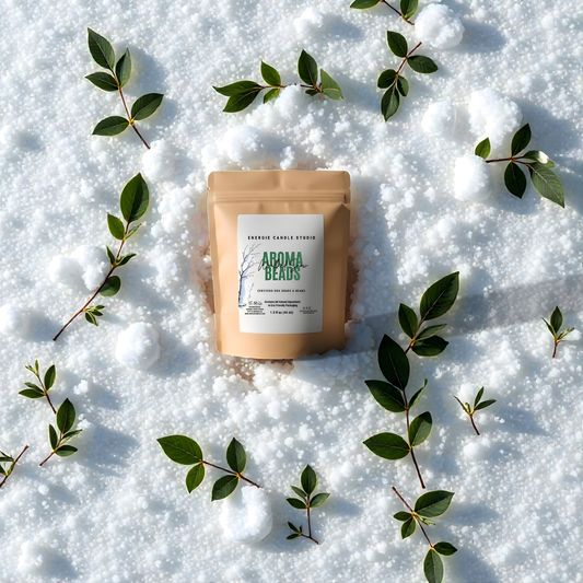 Aroma beads package on snow with green leaves