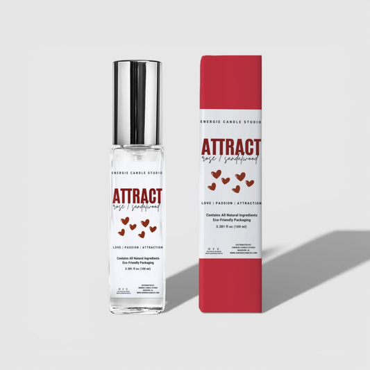Perfume bottle and packaging with 'Attract' text on a gray background
