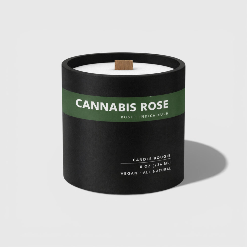 Candle with 'Cannabis Rose' label on a white background