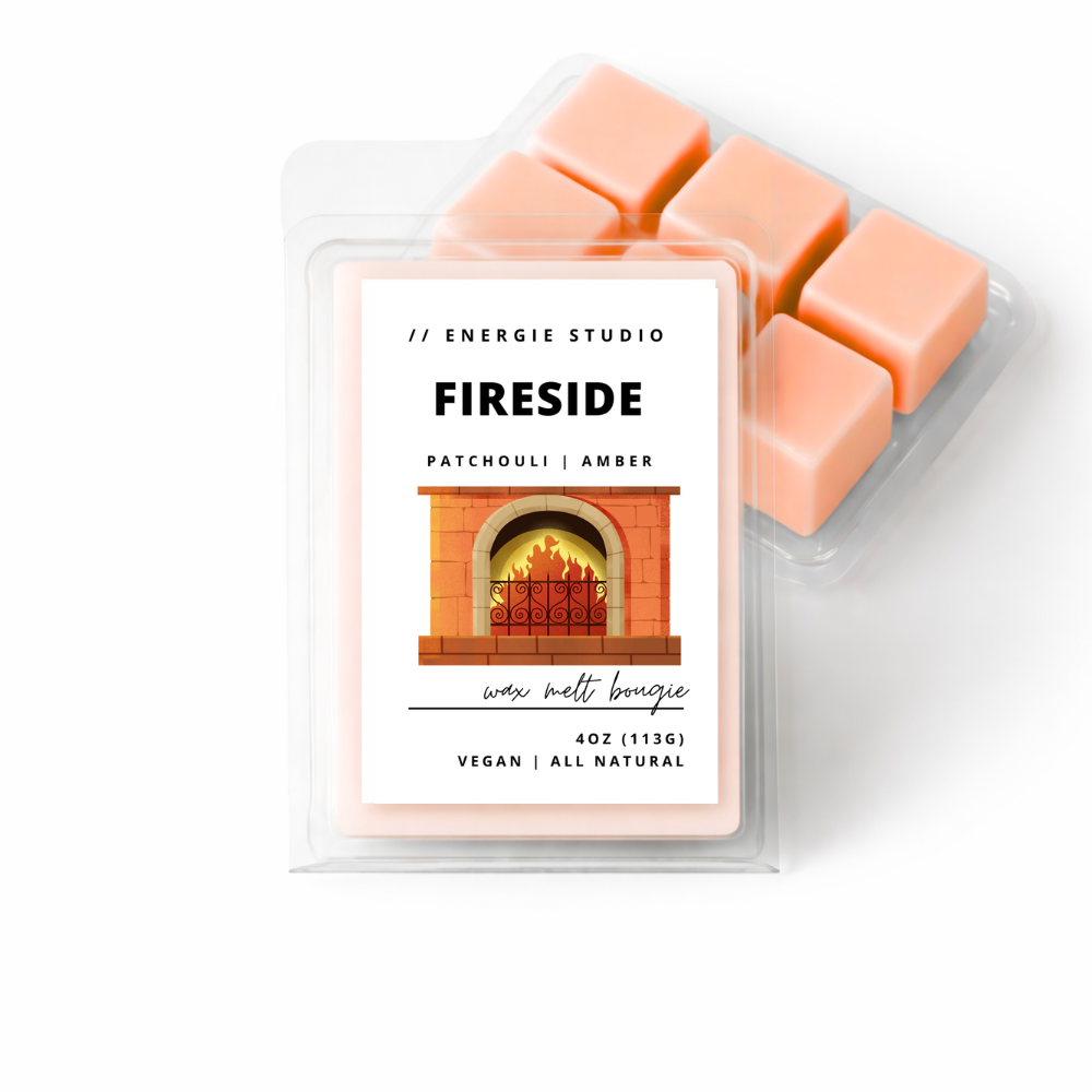 Wax melts with packaging labeled 'Fireside' from Energie Studio on a white background