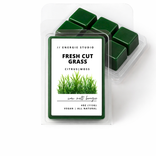 Pack of wax melts labeled 'Fresh Cut Grass' by Energie Studio on a white background