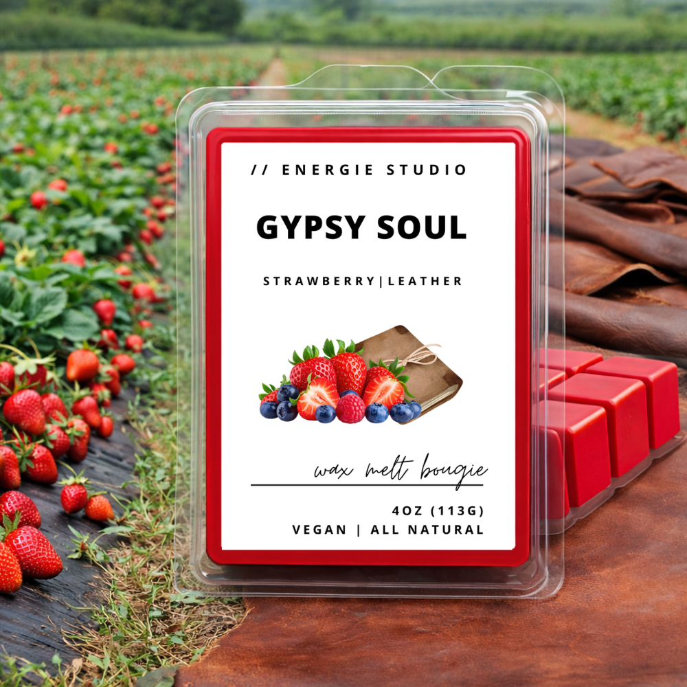 Wax melt packaging with 'Gypsy Soul' label, strawberries, and leather texture in the background