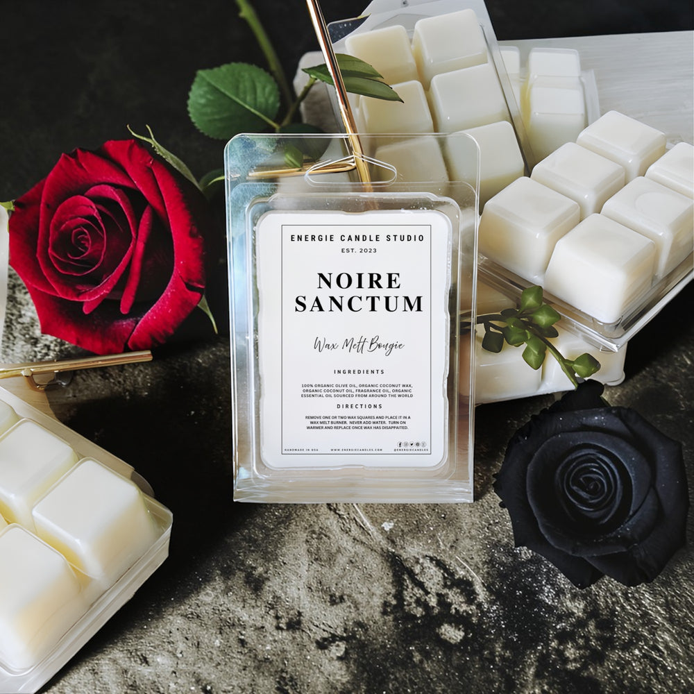Energie Candle Studio Noire Sanctum wax melt package with red and black roses on a dark surface