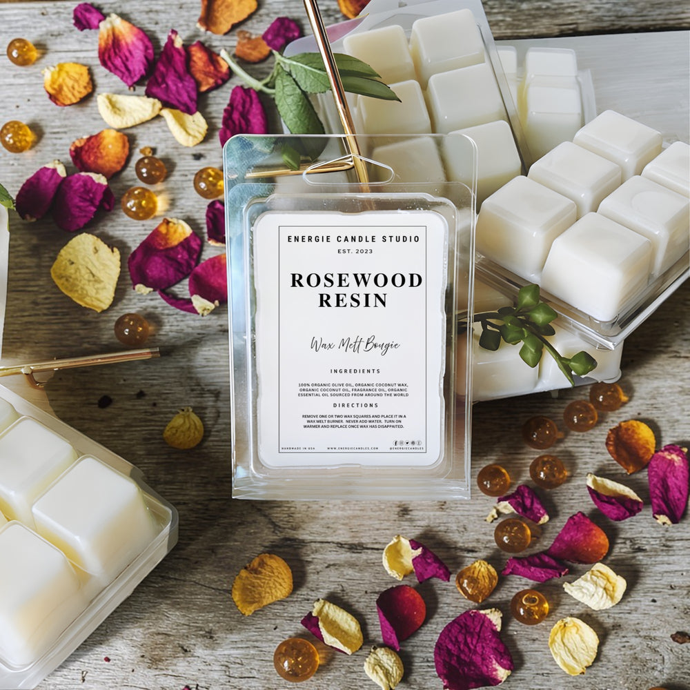 Rosewood resin wax melts packaging with dried flowers on a wooden surface
