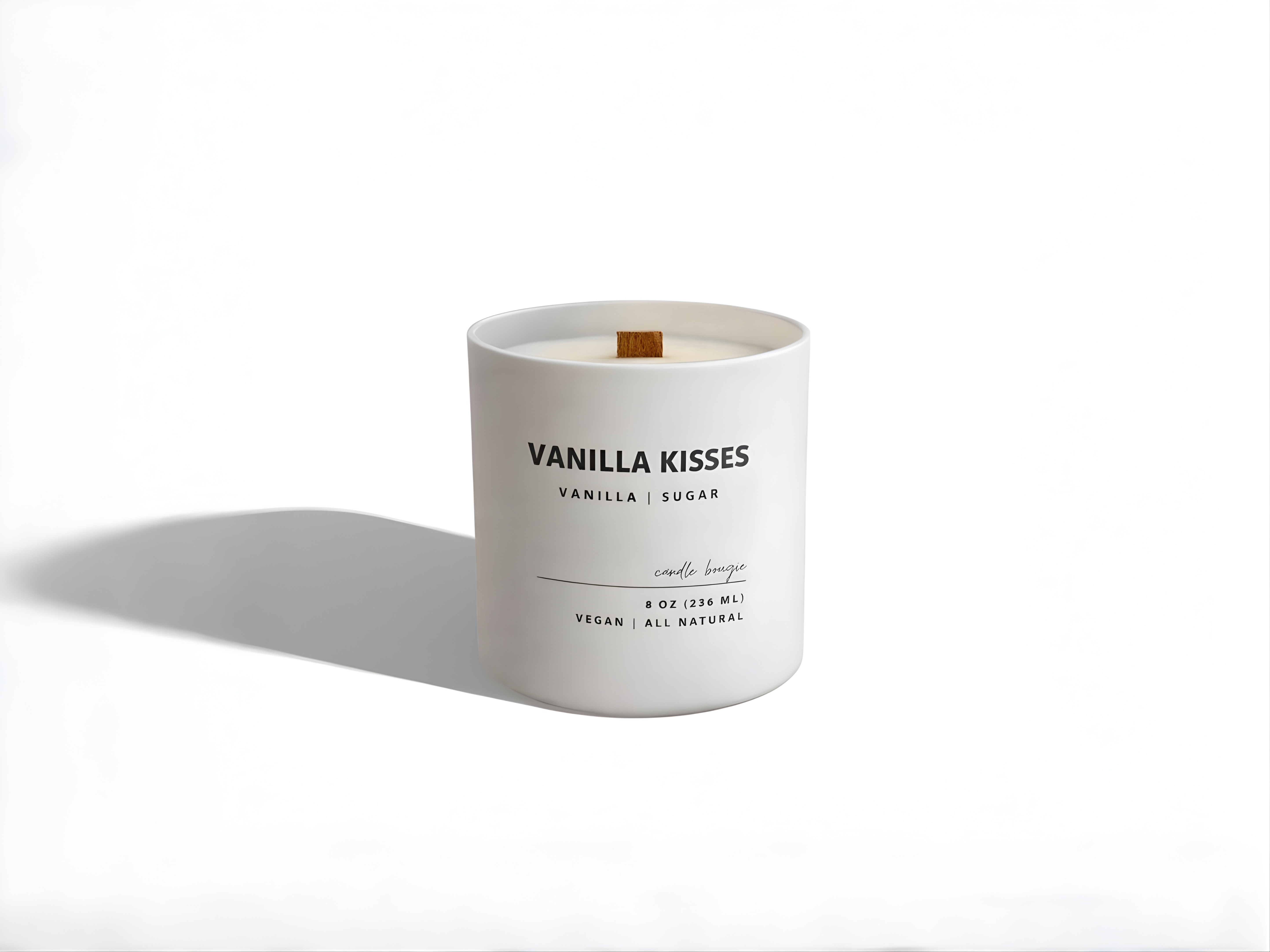 Vanilla scented candle labeled 'Vanilla Kisses' on a white background
