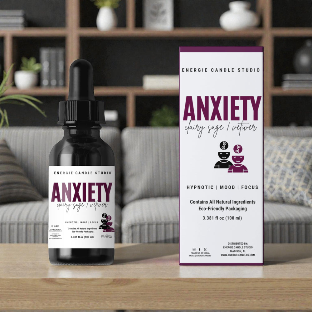 Energie Candle Studio Anxiety oil bottle and packaging on a table with a blurred background