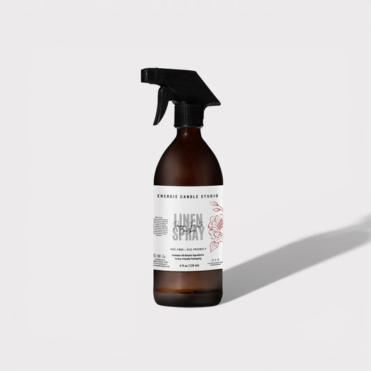 Brown spray bottle with a label on a light gray background