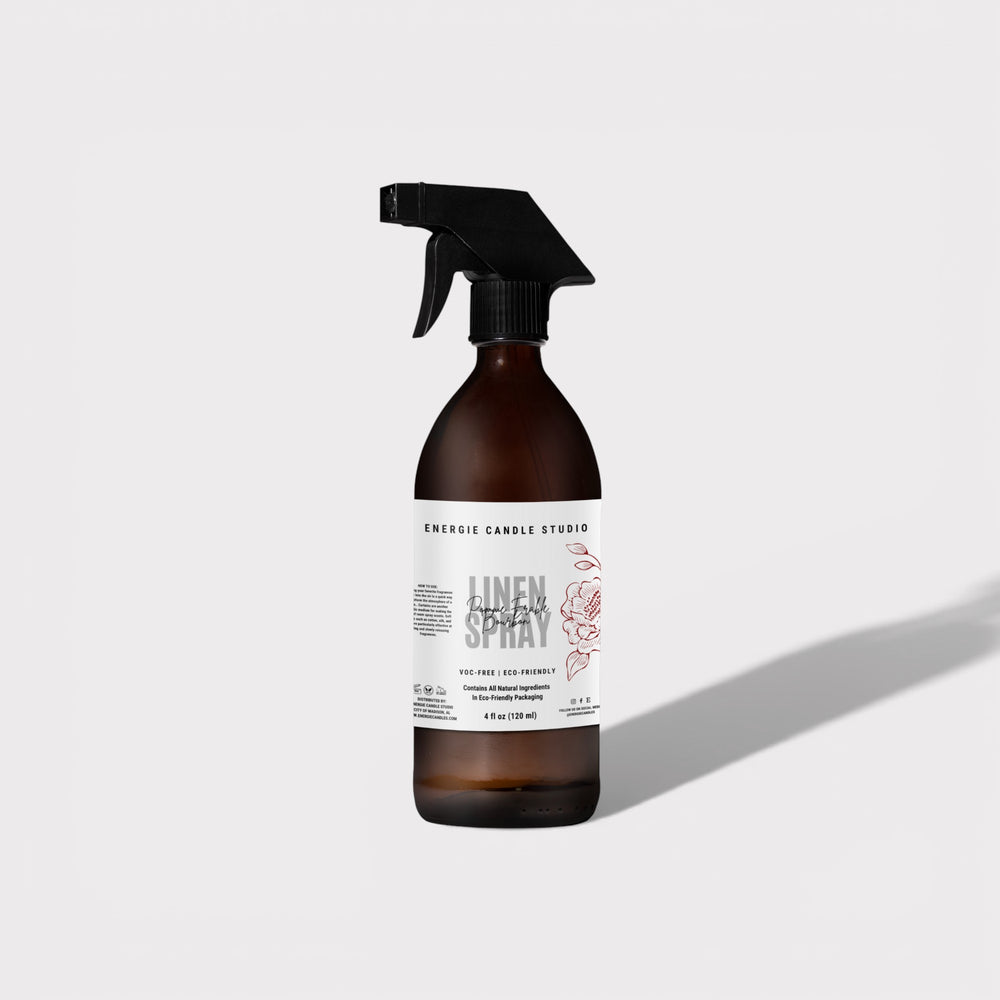 Brown spray bottle with a label on a light gray background