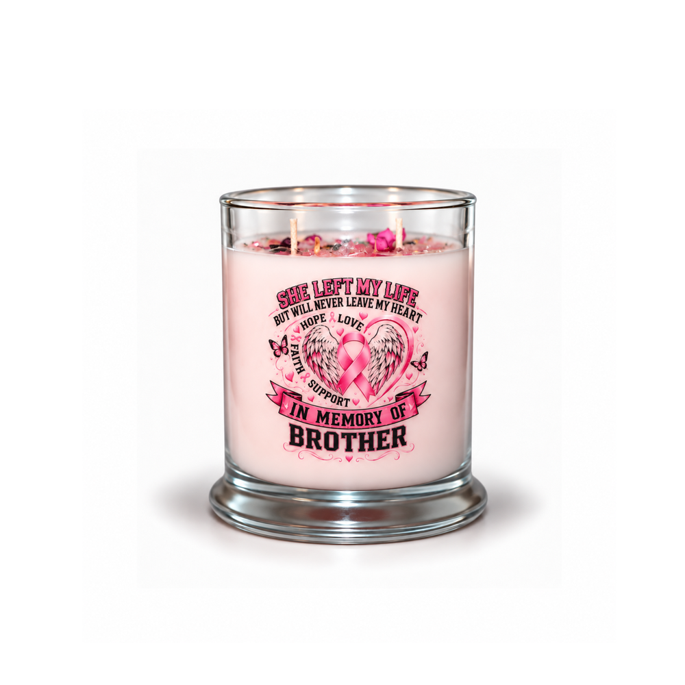 A pink scented candle in a clear glass jar with a silver-toned base, featuring a printed memorial design for a brother with a pink ribbon and wing motif on the front.