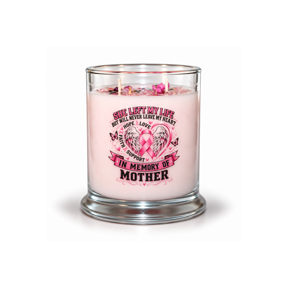 A pink scented candle in a clear glass jar with a printed memorial design on the front. The candle has pink wax, a pink awareness ribbon graphic, and decorative text reading 'See Left My Life But I Will Never Leave My Heart.