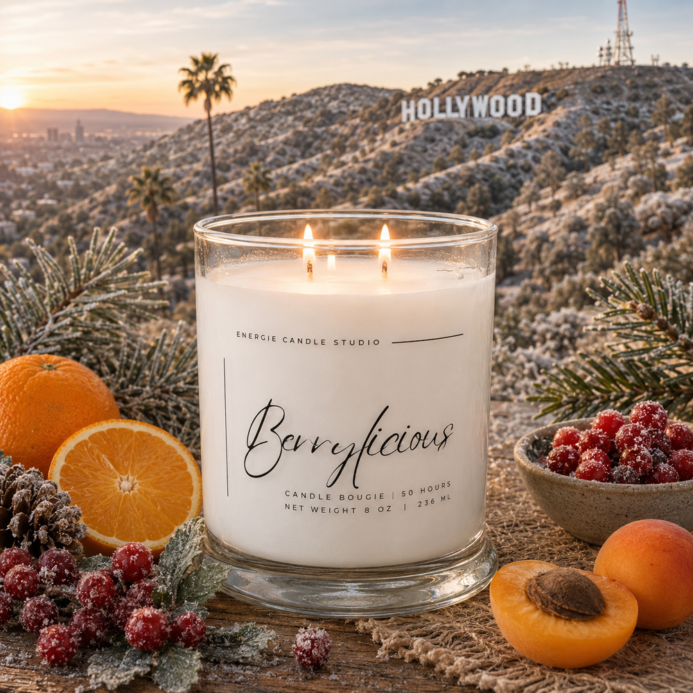 Candle labeled 'Berrylicious' with oranges, berries, and apricots in front of the Hollywood sign.