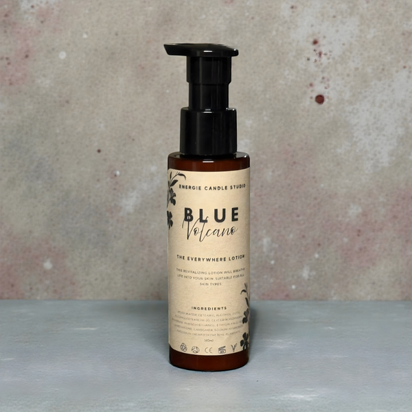 Bottle of 'Blue Volcano' lotion with a pump on a textured surface