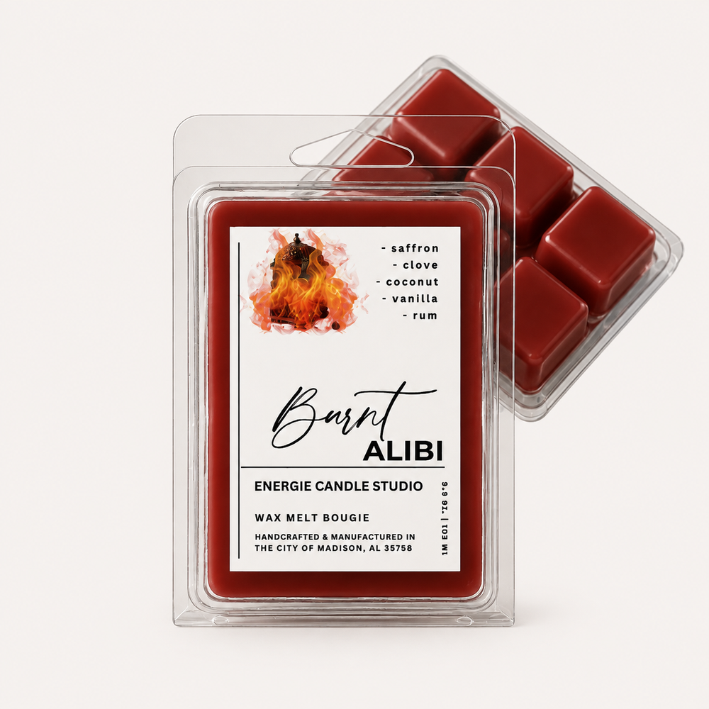 Two clear plastic clamshell packages of wax melts on a light warm gray background. The front package shows a red wax melt with a white label reading 'Burnt ALIBI' and listing scents: saffron, clove, coconut, vanilla, and rum.
