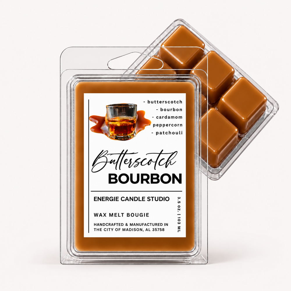 Two clear plastic wax melt clamshells on a light gray studio background. The front package shows a white label reading 'Butterscotch Bourbon' with a small whiskey glass graphic and scent notes including butterscotch, bourbon, cardamom, peppercorn, and patchouli.
