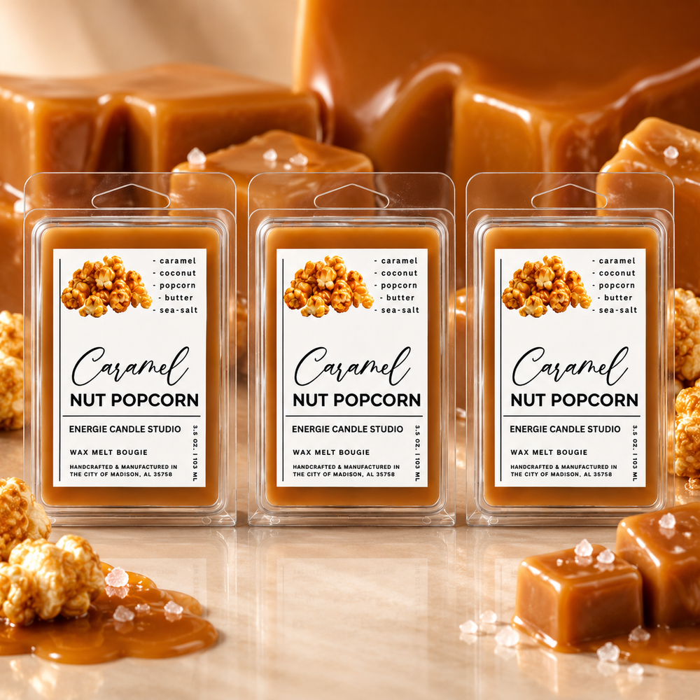 Three wax melt packages labeled 'Caramel Nut Popcorn' arranged in a row, with caramel and popcorn pieces styled around them on a warm reflective surface.