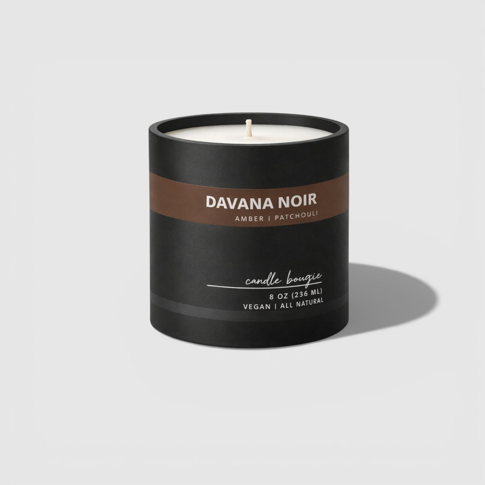 Davana Noir candle with black and brown label on a light gray background
