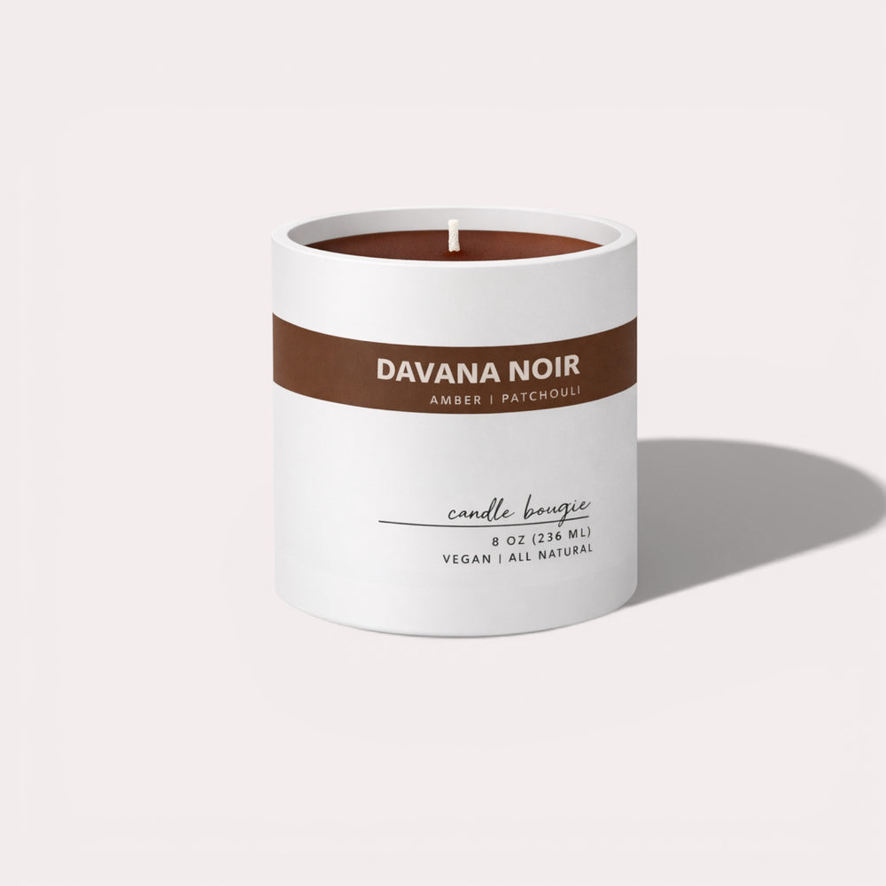 Candle with 'Davana Noir' branding on a white background