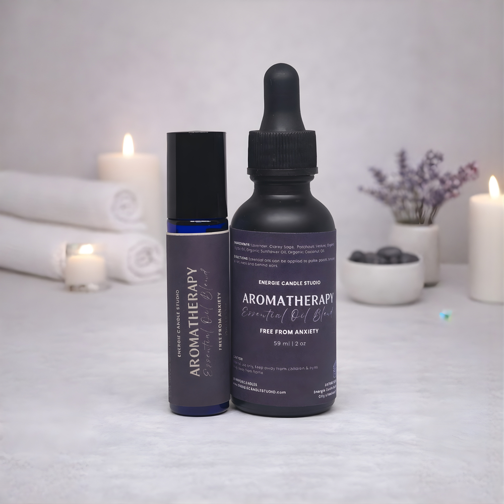 Two aromatherapy products on a white surface with candles and lavender in the background.