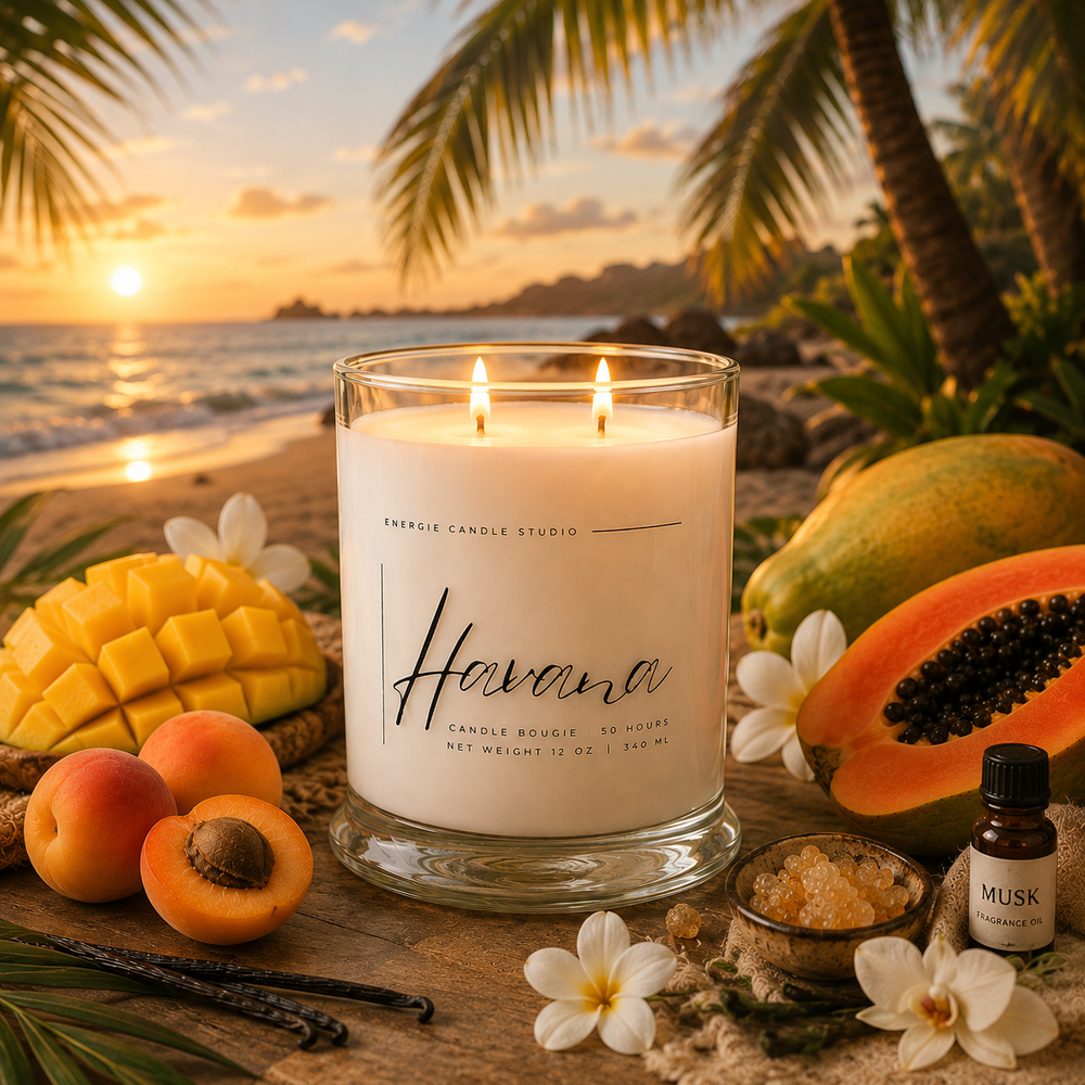 Candle labeled 'Havana' on a beach setting with fruits and flowers.