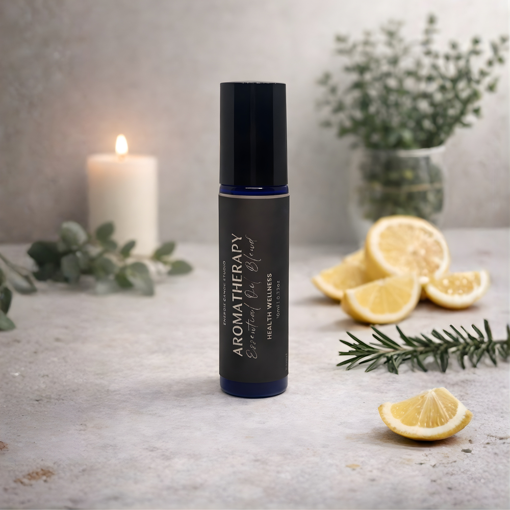 Aromatherapy essential oil bottle with lemons and a candle on a textured surface