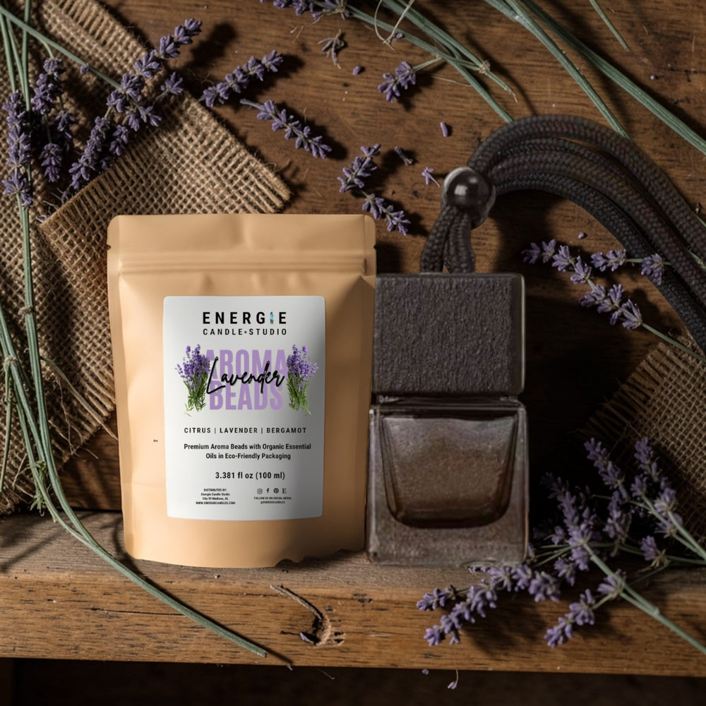 Energie Candle Studio lavender product on a wooden surface with lavender flowers