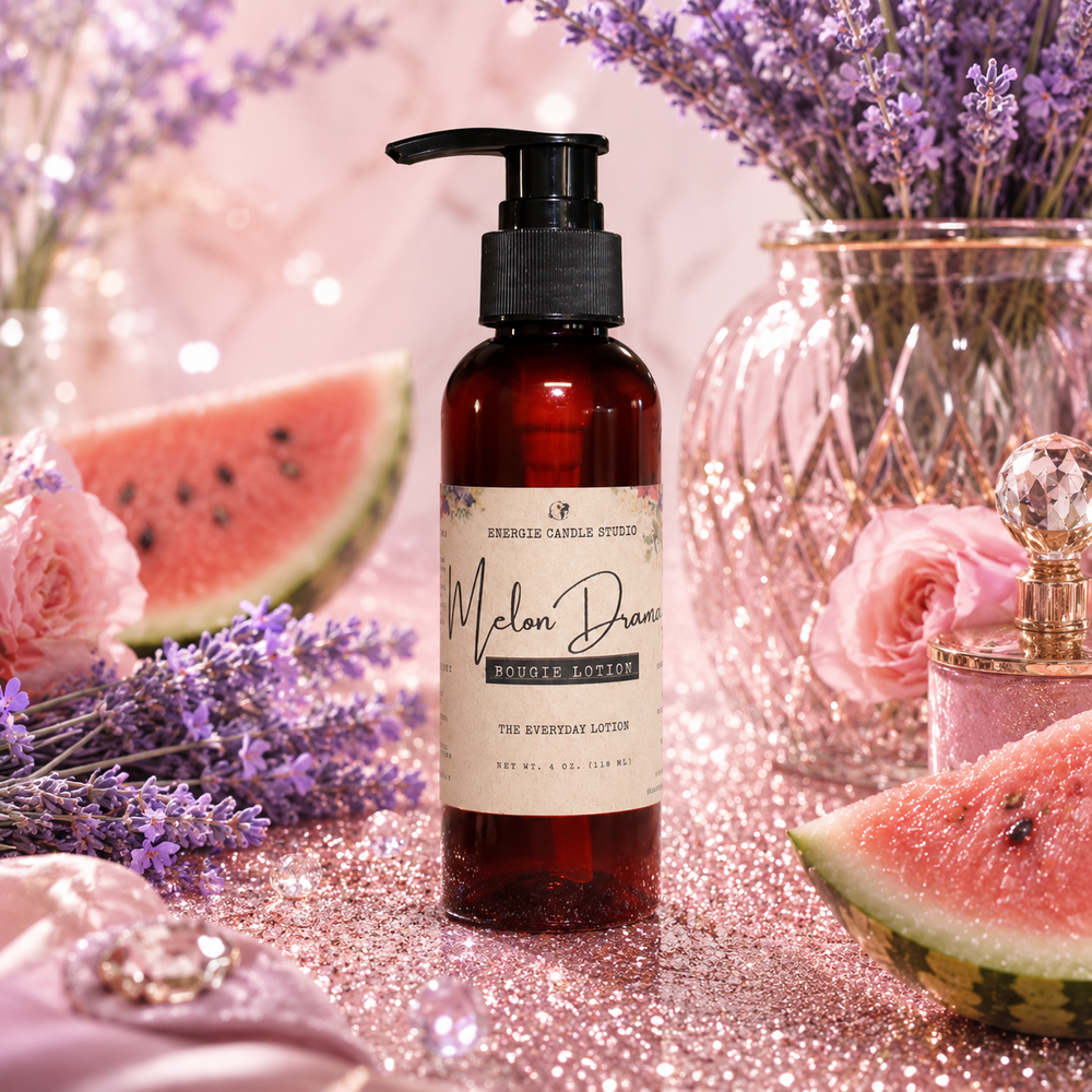 A bottle of Malon Daze Rose Aromatherapy Everyday Lotion stands on a glittery pink surface surrounded by lavender sprigs, watermelon slices, pink roses, and a glass vase, with a soft pink blurred background.