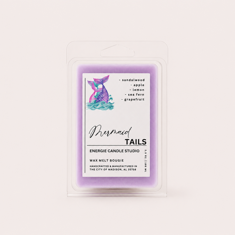 A packaged wax melt in a clear plastic clamshell package. The wax itself is a light lavender purple, and the front label features a mermaid tail illustration with the text 'Mermaid TAILS' and 'ENERGIE CANDLE STUDIO'.