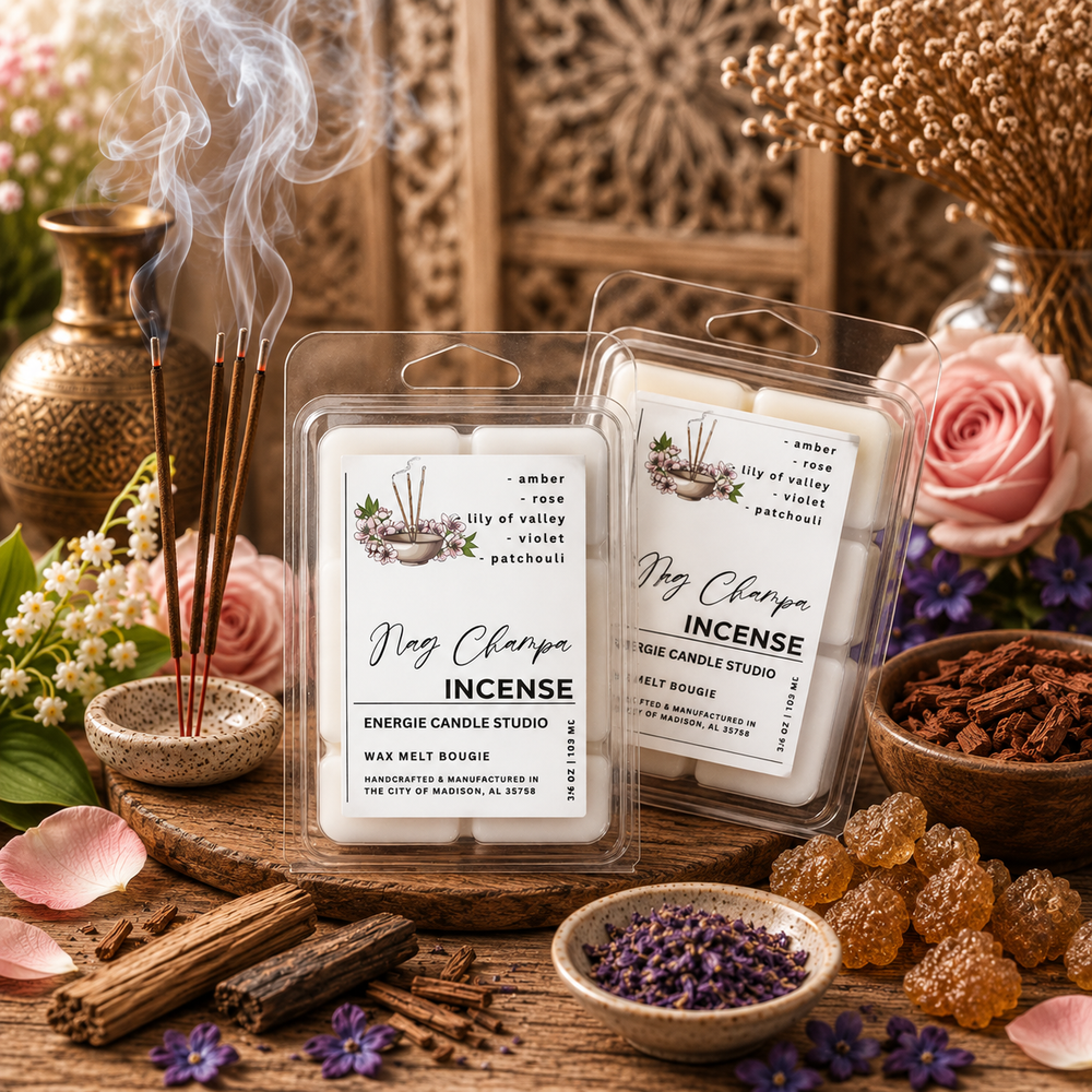 Two packaged wax melts candles labeled 'My Charme INCENSE' are displayed on a wooden surface with incense sticks, dried flowers, roses, cinnamon sticks, and amber-like beads in a styled setting. The product packaging is clear plastic with white labels and the wax inside appears creamy off-white.