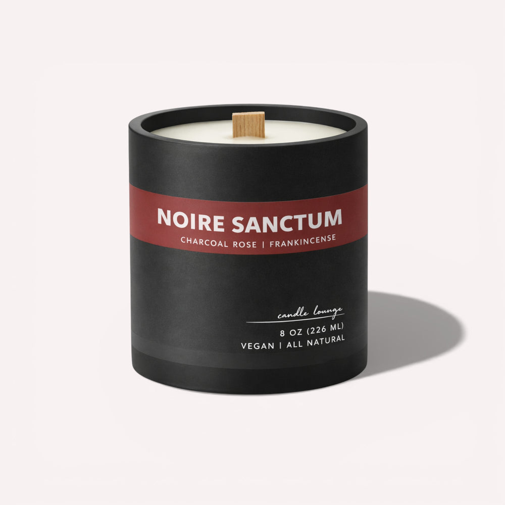 Noire Sanctum candle with black and red label on a white background