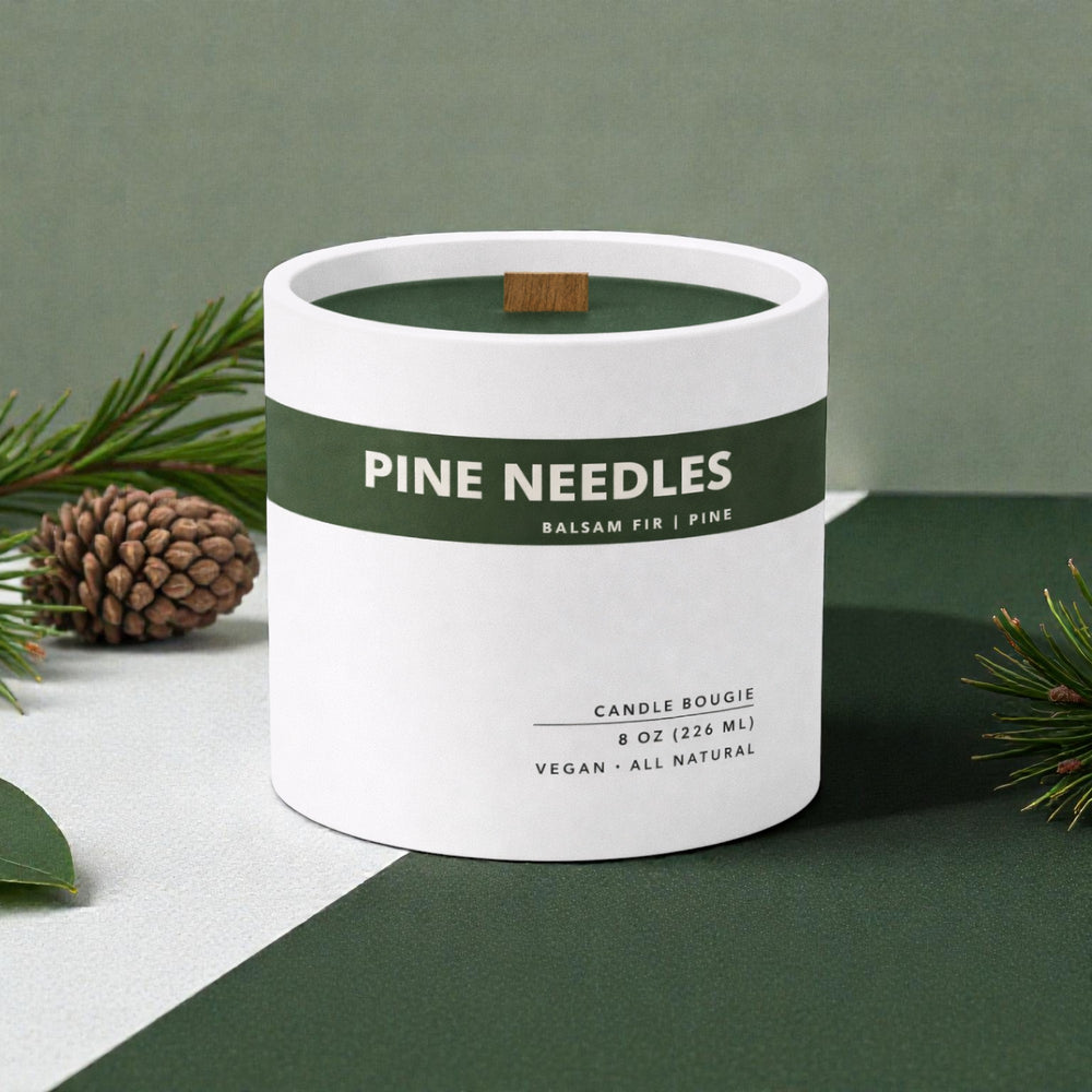 Candle container labeled 'Pine Needles' with a green label on a green and white background.