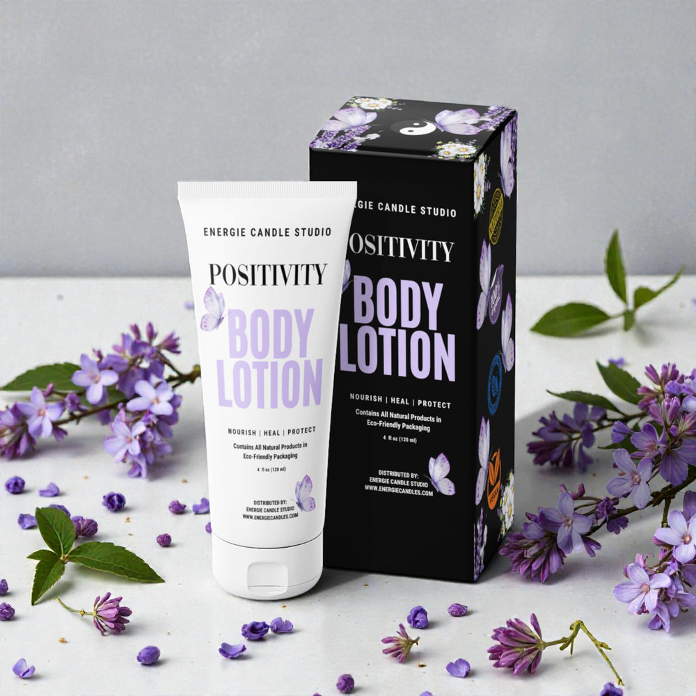 Body lotion with packaging and purple flowers on a light surface