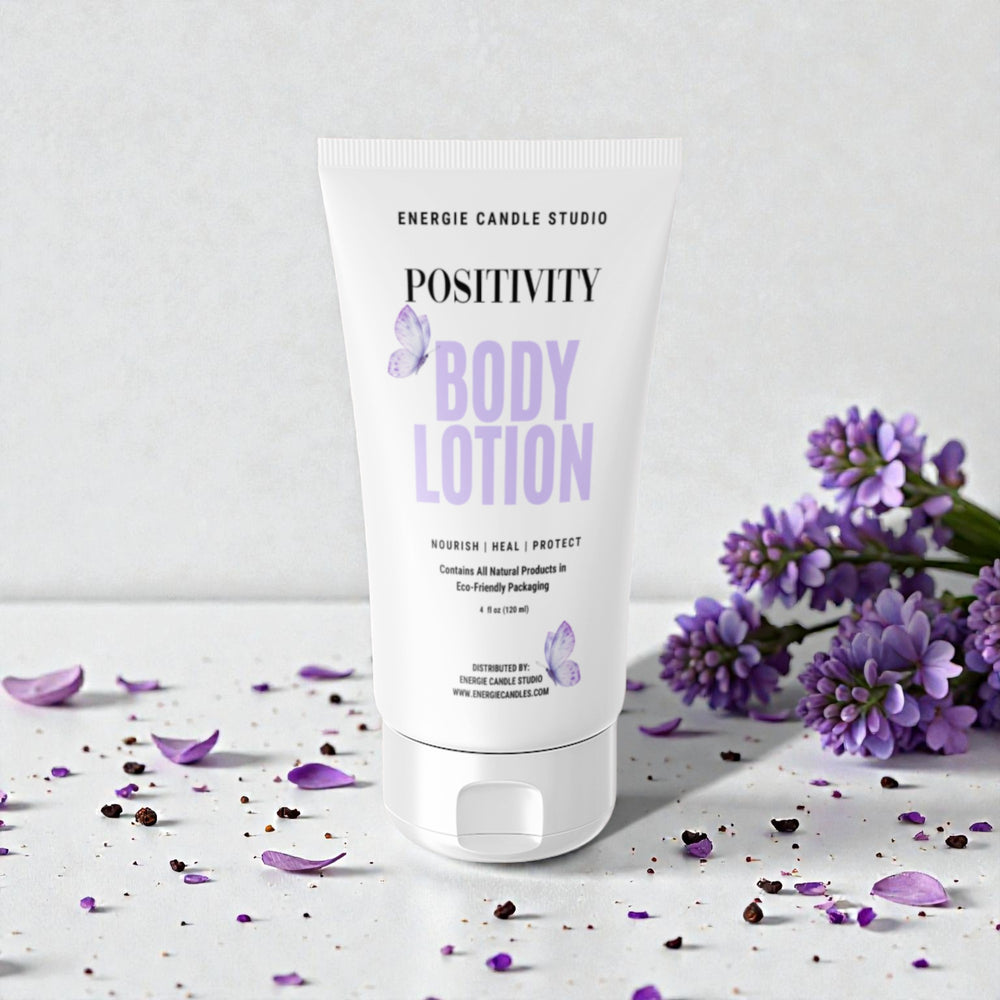 Body lotion tube labeled 'Positivity' with lavender flowers on a light background