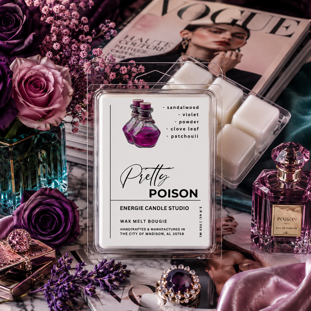 A wax melt package labeled 'Pretty POISON' by Energie Candle Studio is centered in a styled flat-lay with purple roses, a Vogue magazine, perfume bottles, jewelry, and pink fabric. The main sold item appears to be the wax melt in a clear clamshell with a white label and purple bottle illustration.