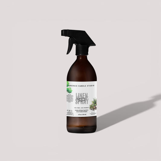 Brown spray bottle with a label on a light gray background