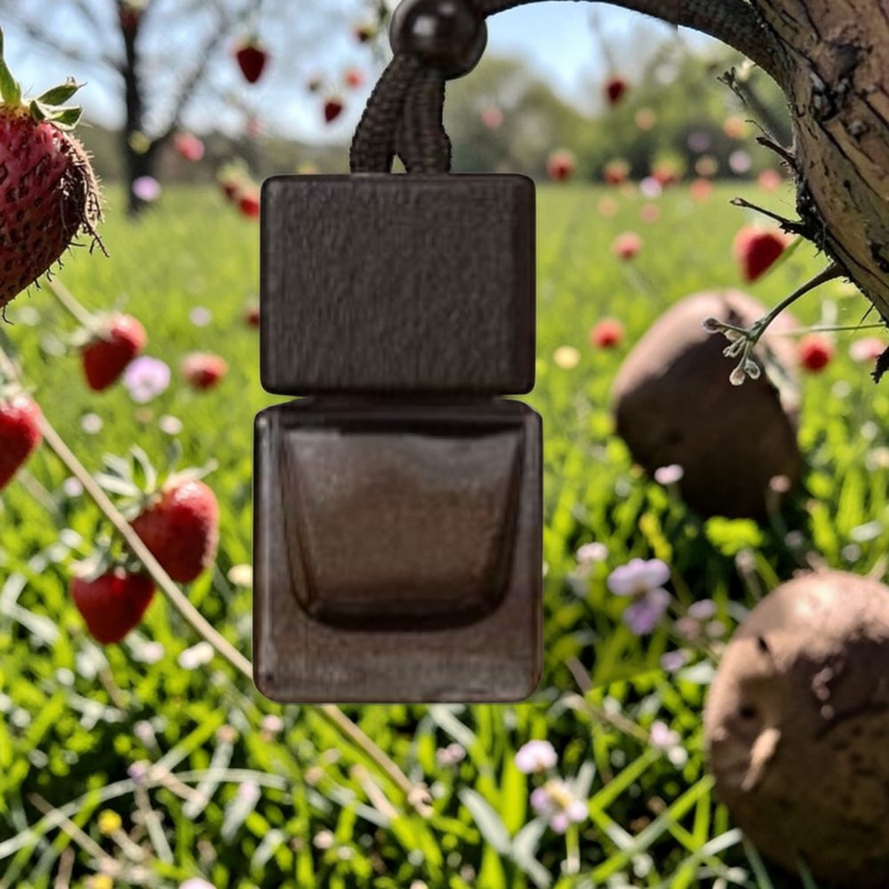 Brown square pendant on a chain against a natural background with fruits and plants.