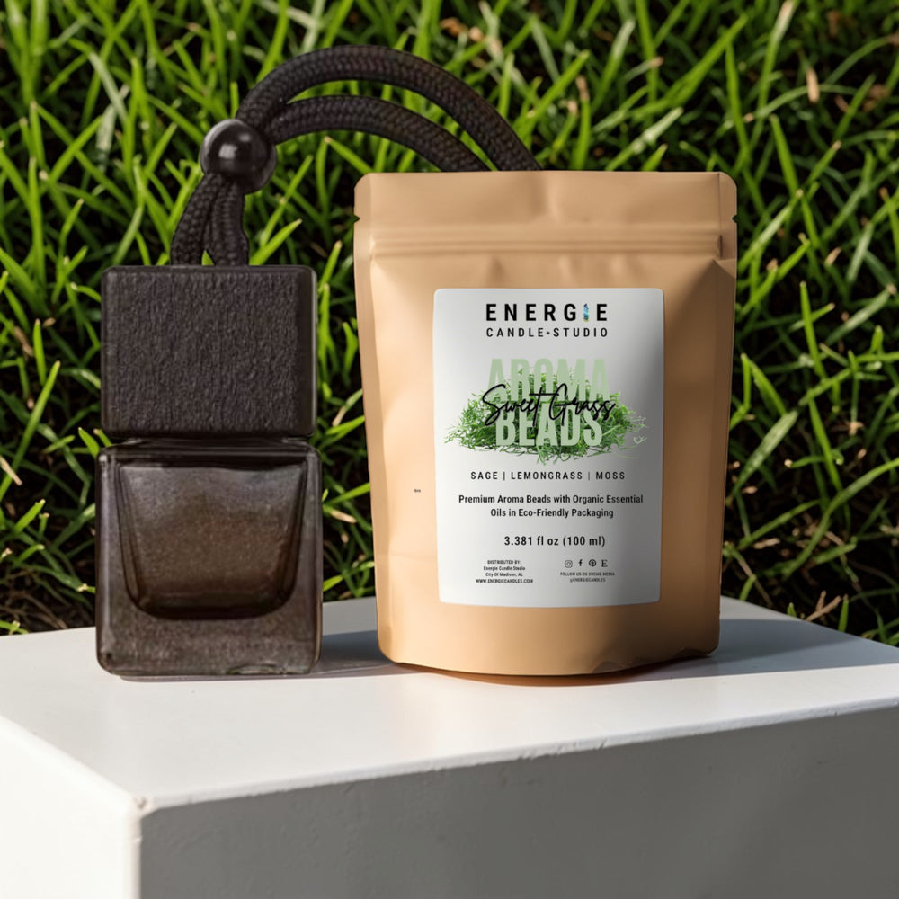 Energie Candle Studio product with a small black container on a grassy background