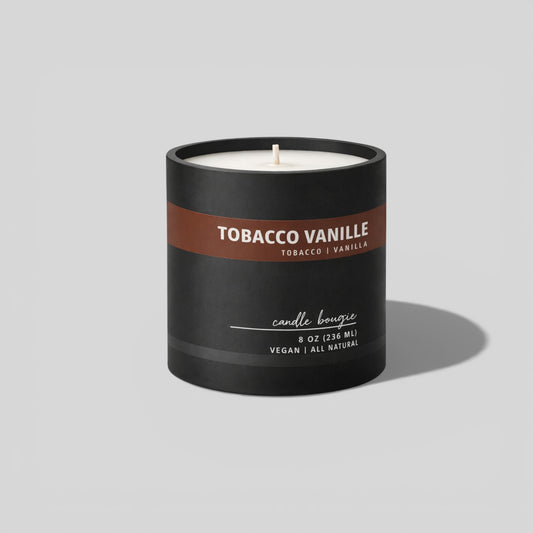 Candle labeled 'Tobacco Vanille' with a black container on a light gray background