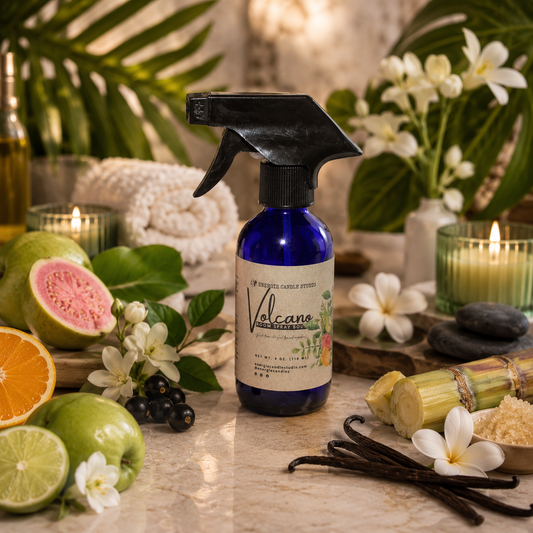 Volcano candle spray bottle on a table with fruits, flowers, and candles in a warm setting