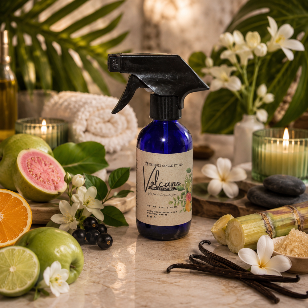 Volcano candle spray bottle on a table with fruits, flowers, and candles in a warm setting