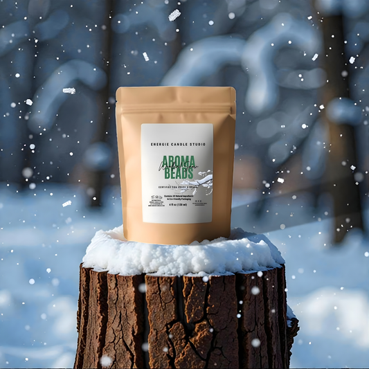 Package of Aroma Beans on a snowy stump with a blurred snowy background